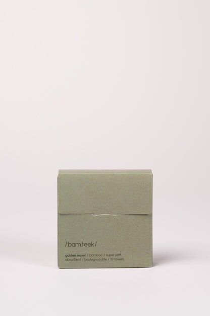 Hand holding the Golden Travel Bundle of bamboo skincare towels by Bamteek. Hand holding the Golden Travel Bundle of bamboo skincare towels by Bamteek.