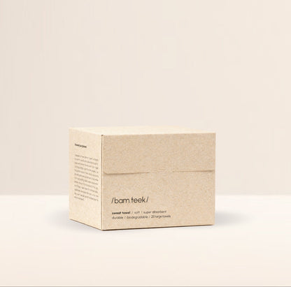 Hand reaching for a single-use sweat towel from the Sweat Bundle by bamteek