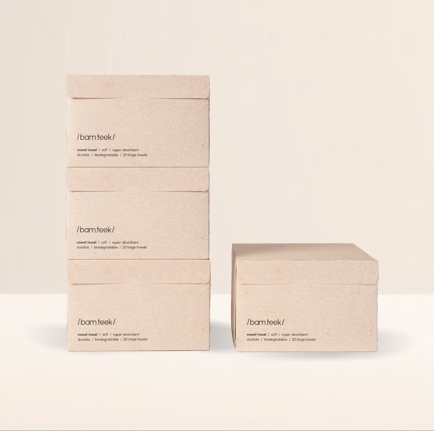 Stack of Bamteek sweat towels in eco-friendly packaging, promoting the Sweat Bundle for active skincare.